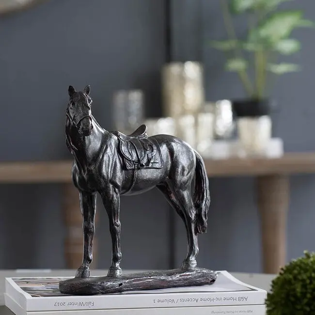 Equestrian-Themed Bronze Saddle Sculpture 1